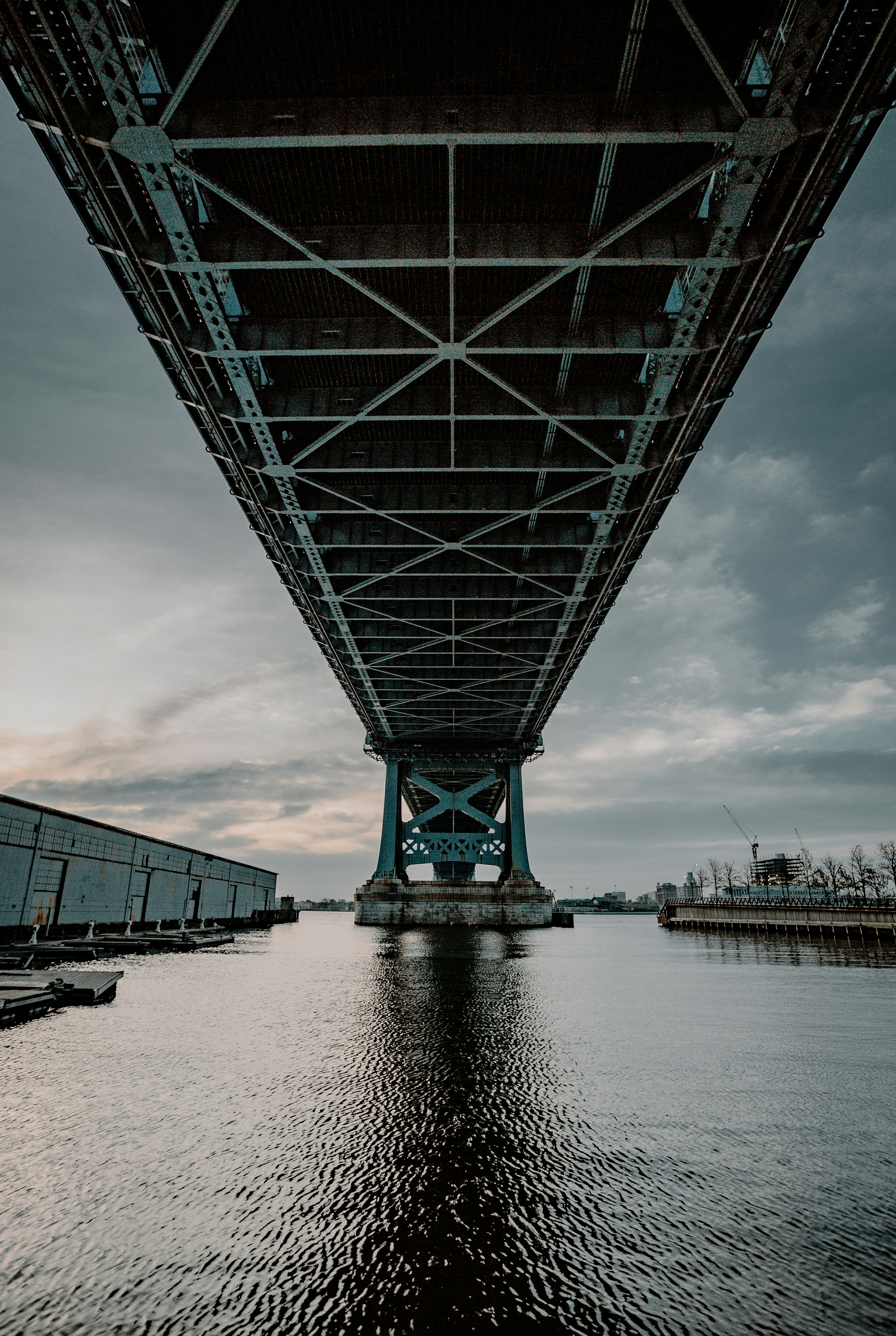 gray metal bridge under gray sky
